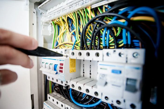 electrician repairing a switchboard