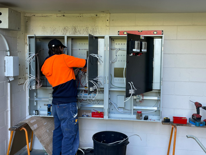 Allec electrician fixing a switch board