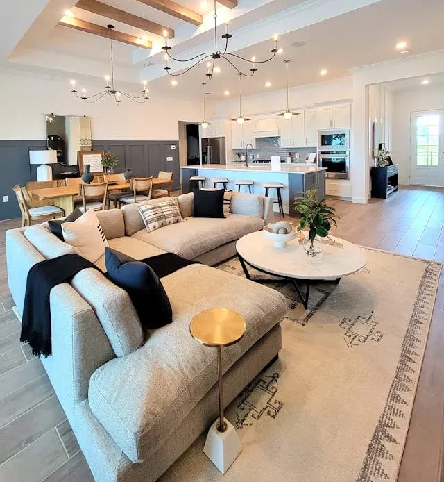 A large open living room with a ceiling fan