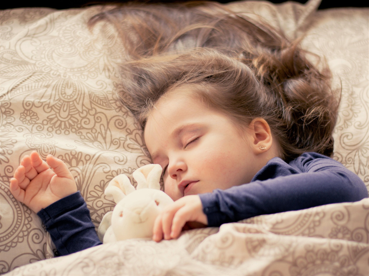 young girl in a blanket