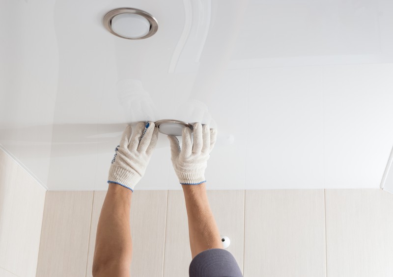 Electrical professional mounting lights on the ceiling