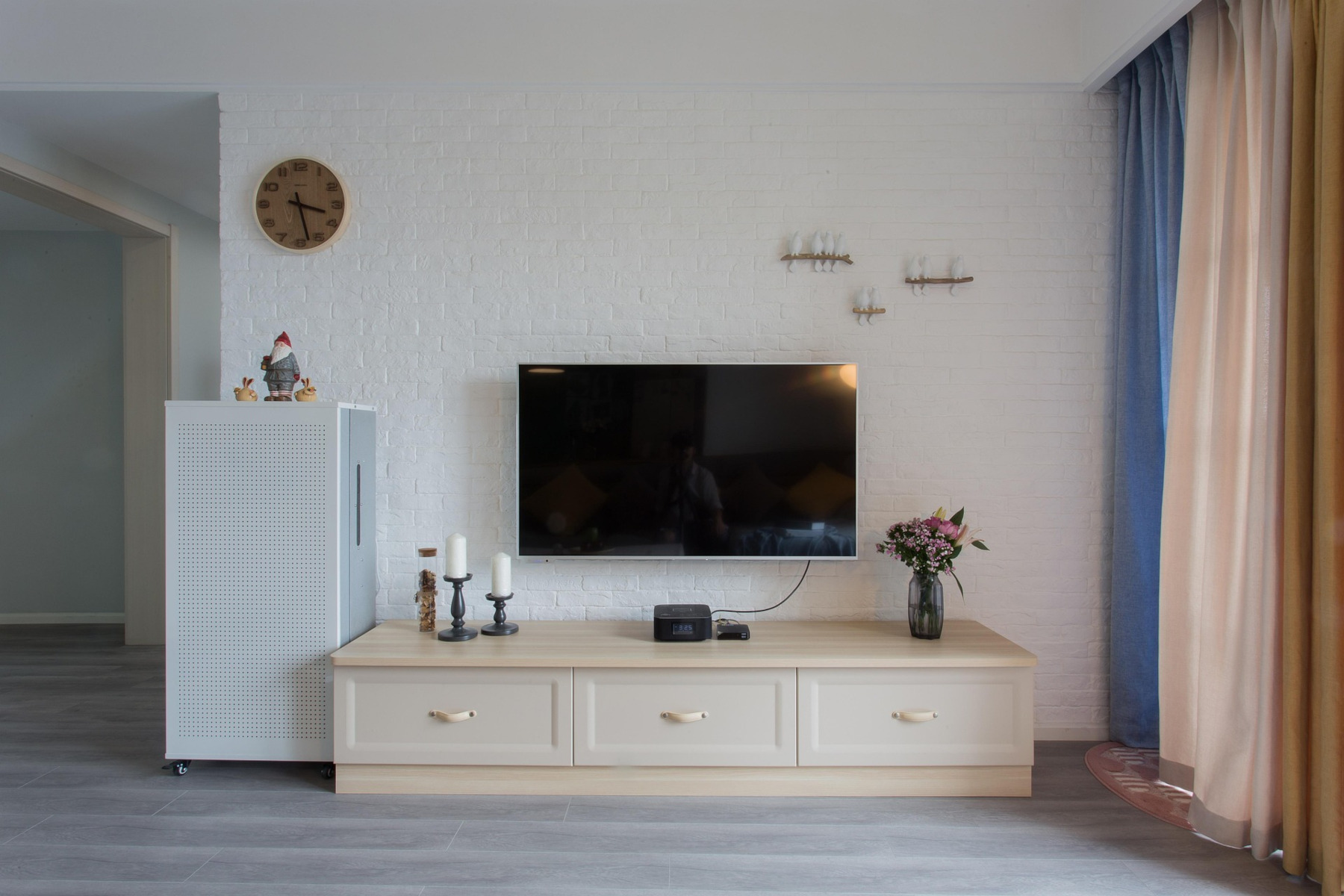 wall mounted TV in a bedroom
